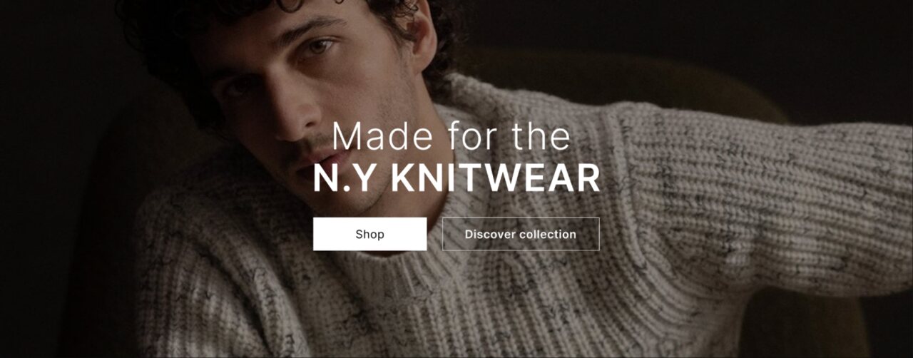 Баннер магазина: мужчина в сером вязаном свитере, надпись «Made for the NY Knitwear» и кнопки Shop и Discover collection